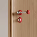 Red Metal Door Handle on Wooden Door with Matching Lock Design Elements