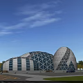 Modern Museum Building With Hemispherical Geometric Glass Metal Structures And Green Lawn Parking Area