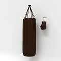 Hanging Brown Punching Bag and Boxing Gloves as Essential Sports Equipment for Fitness Training