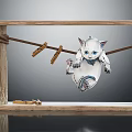 White Cat Doll Hanging On Clothesline With Wooden Frame And Clothespins