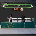 Modern Shopping Mall Store With Green Counter Stacked Pastries Staff And Circular Light