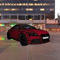 Red Audi Sports Car Parked On Urban Street With Tall Buildings And Evening Lights