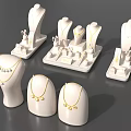 Elegant Jewelry Display with White Mannequins Necklaces and Earrings on Stands
