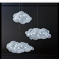 Delicate Cloud Shaped Chandeliers With Lace Design And White Lights Hanging In Dark Background