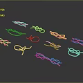 Gold Tone Metal Knot Ornaments In Various Shapes On Black Background