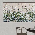 Vibrant Floral Painting On Light Wall With Wooden Table And Chairs