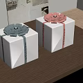 Decorative White Gift Boxes With Colored Ribbons And Bowknots On Wooden Table