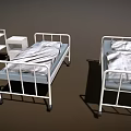 Essential Medical Equipment in Hospital Ward Featuring Beds Oxygen Cylinders and Patient Monitor