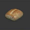 Artisan Whole Grain Bread With Crusty Surface And Grainy Texture On Black Background