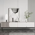 Modern TV Stand With White Panels Black Legs Decorative Artwork Table Lamp And Green Plant