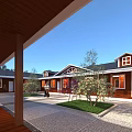 Red Guesthouse Building with Black Roof Wooden Boardwalk Blue Pools Surrounding Trees and Distant Mountains