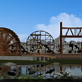 Garden Ornaments Scene With Water Wheels Rockery Pond Lotus And Green Plants