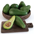 Fresh Green Avocados in Wooden Bowl and Halved on Wooden Board with Seed