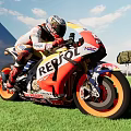 Racing Motorcycle With REPSOL Logo And Rider On Green Grass Field Under Blue Sky