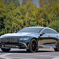 Luxury Mercedes AMG GT Coupe Silver Black Wheels on Road with Green Forest