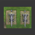 Military Cannons As Weapons Placed On Green Grass With Stone Bases