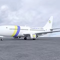 Transavia Airliner White With Yellow And Blue Stripes Parked On Airport Runway Under Cloudy Sky