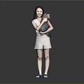 Woman Holding Cat Wearing Sleeveless Top And Shorts With Blue Sandals On Gray Background