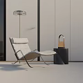 Modern Leisure Chair with Floor Lamp Side Table and Handbag Decor in Minimalist Living Room