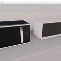 Modern Two Black And White Microwave Ovens On White Countertop With Light Gray Wall