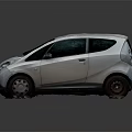 White Small Hatchback Car With Modern Sleek Exterior And Clean Design