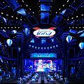 Stylish Modern Bar Interior With Blue Lighting 1664 Logo Stage Tables And Ceiling Design
