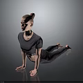 Woman Practicing Yoga Pose In Gray Athletic Outfit On Smooth Dark Floor