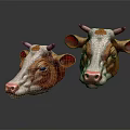 Two Brown And White Cow Head Models With Pink Noses And Big Ears