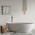 Modern White Bathtub With Wooden Laundry Basket Black Towel Rack Gold Lights And Gray Tile Floor