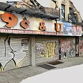 Urban Commercial Street With 99 Cent Store Sign Graffiti Roller Shutters And Weathered Buildings