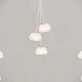 Multiple Modern White Glass Pendant Lights Hanging on Gray Interior Wall 3d model