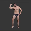 A Muscular Man Flexing His Arm Muscles With Bare Torso On Gray Background