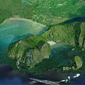 Scenic Garden Landscape With Lush Vegetation Rocky Outcrops Clear Blue Water And Sandy Beach