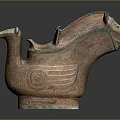 Ancient Ceramic Animal Shaped Vessel With Carved Patterns And Green Accents