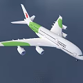 Saudia Passenger Airplane With White Green Livery Flying Over Sea At Sunset
