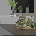 Modern Kitchen Countertop With Glass Water Pitcher Appliances Green Herbs And Lemon Slices