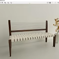 Leisure Bench With Wooden Frame And Woven White Seat Near White Vase With Yellow Flowers