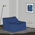 Blue Ribbed Bean Bag Chair with Side Table Plant Floor Lamp and Abstract Painting
