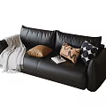 Modern Black Leather Two Seater Sofa With Decorative Pillows Blanket And Book