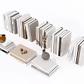 Stacked Books and Magazines With Decorative Vase Walnuts and Small Decor Items