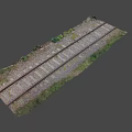 Old Train Tracks With Weathered Wooden Sleepers Gravel And Overgrown Grass In Rural Area
