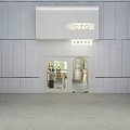 Modern Clothing Store Interior With Dresses Display Table Mannequin Screen And Potted Plant