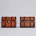 Two Vintage Wooden Trunks With Intricate Carved Patterns And Storage Design