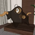 Black And Gold Bull Sculpture With Circular Hollow Design On Wooden Base And Potted Plant