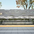 Modern Landscape Wall with Gray Bricks Flowing Water Trees and Stone Steps