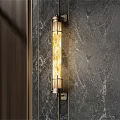 Modern Wall Lamp With Brass Frame Glass Shade Mounted On Marble Wall Emitting Warm Light