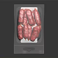 Fresh Red Sausages Packaged In Transparent Plastic Bag On Black Background