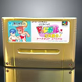 Golden Super Famicom Game Cartridge With Cartoon Characters And Text Labels