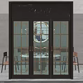 Elegant Dark Framed Sliding Door With Glass Panels And Gold Accents In Dining Room
