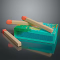 Colorful Wooden Matches With Orange Tips And Green Patterned Matchbox